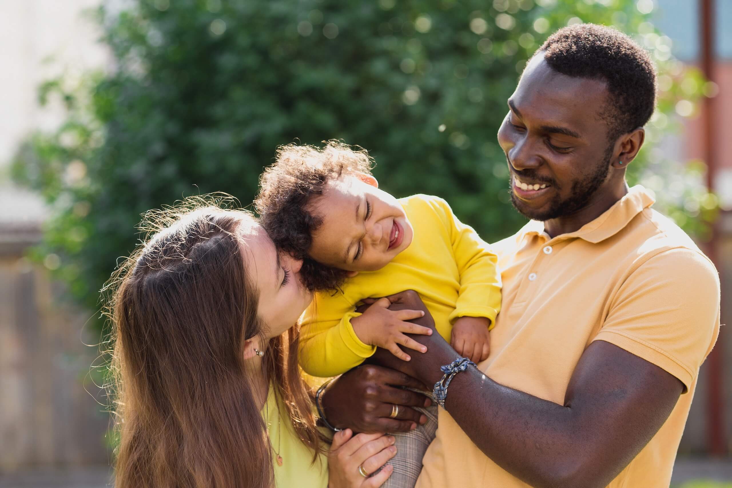 Mother, child and dad outside