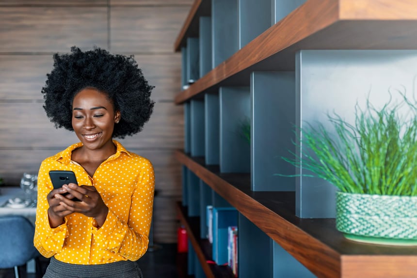 African lady looking at smart phone