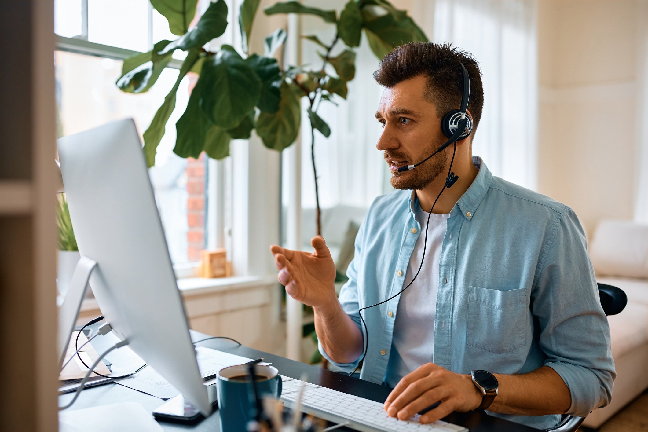 Man on video call on laptop