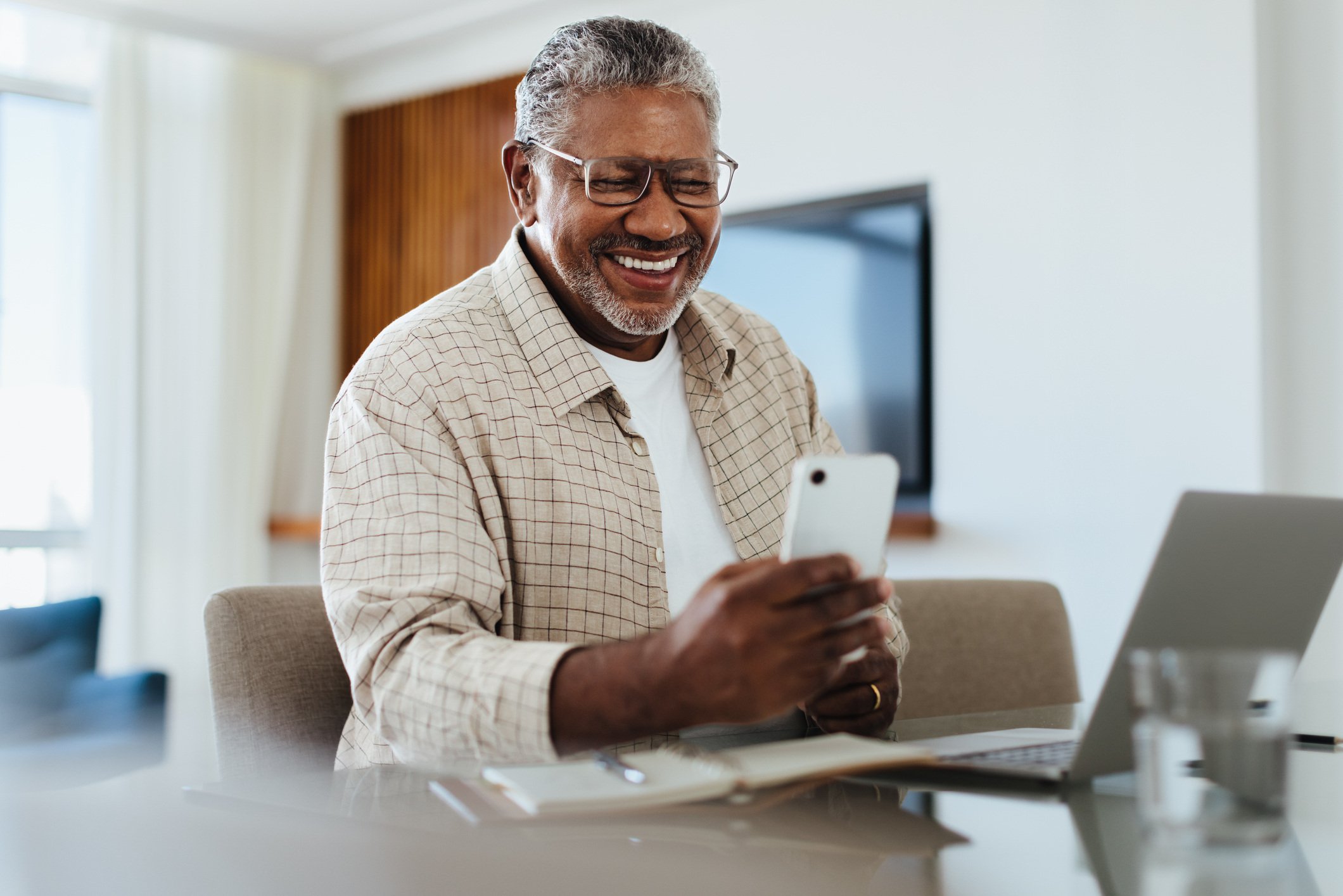 African man looking at smartphone