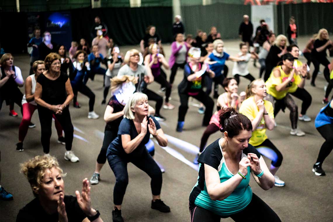 People participating in a zumba class