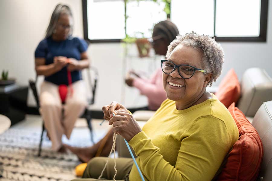 Women sat together and knitting