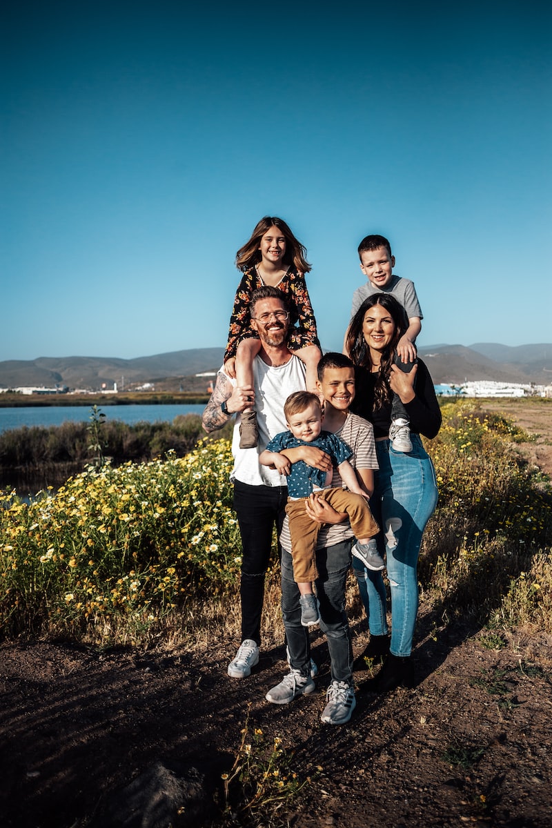 A family of six stood together smiling.