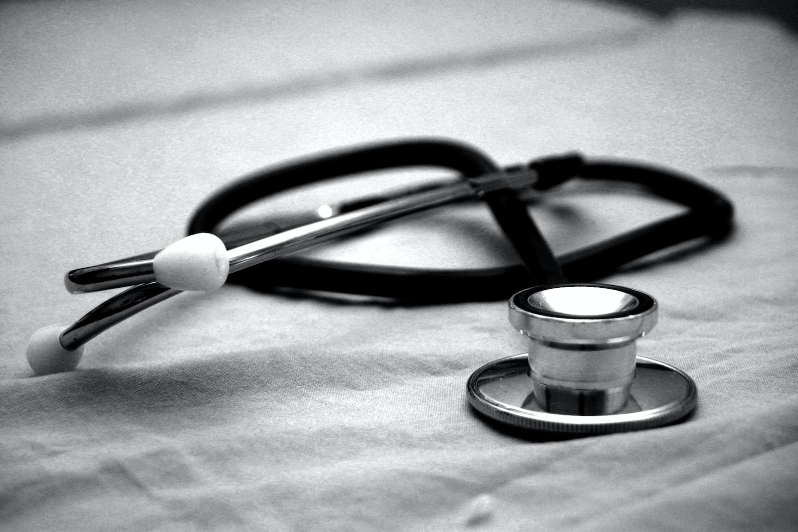 A picture of a stethoscope on a desk.